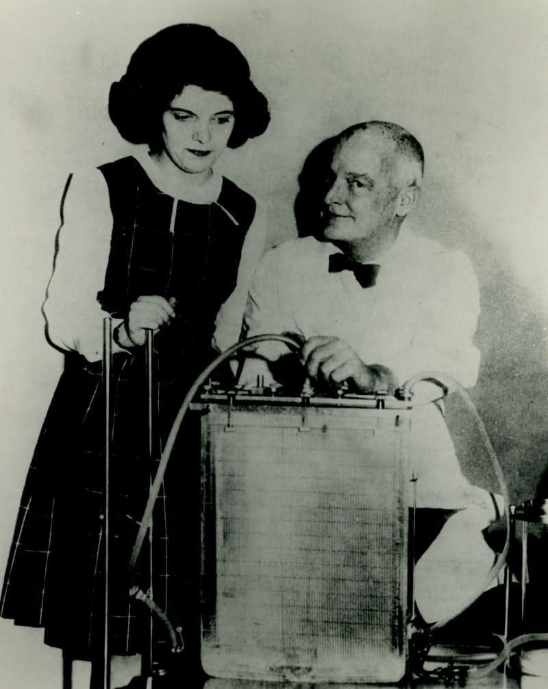 Dr. John H. Gibbon Jr. (left) and Cecelia Bavolek in 1963 with the machine he invented and used to save her life 10 years earlier. (Photo courtesy of the Siegman Archives at Thomas Jefferson University, Philadelphia)